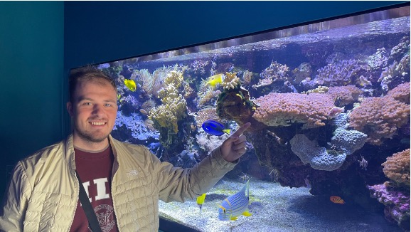 Sam with a coral P. damicornis